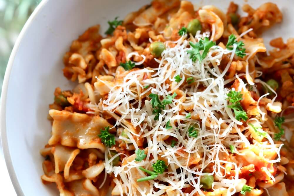Pasta with creamy red sauce, sausage and peas